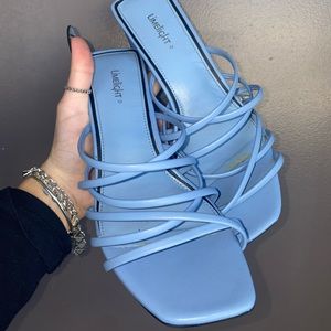 The cutest pair of baby blue rectangle heel sandals. Sad to see these go!